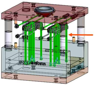 A mold model with an arrow indicating the ejector pins.